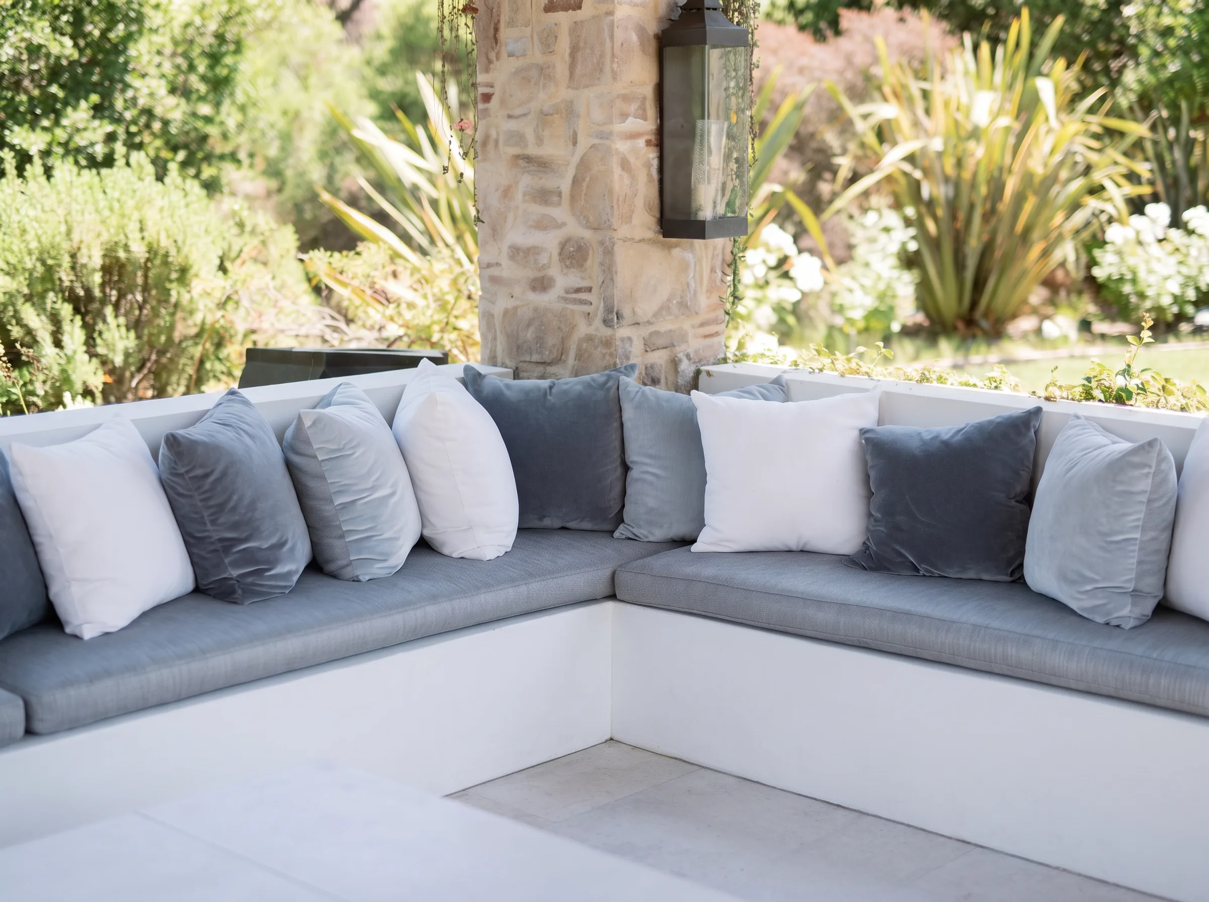 The estate's built-in outdoor lounge with stone column and lantern