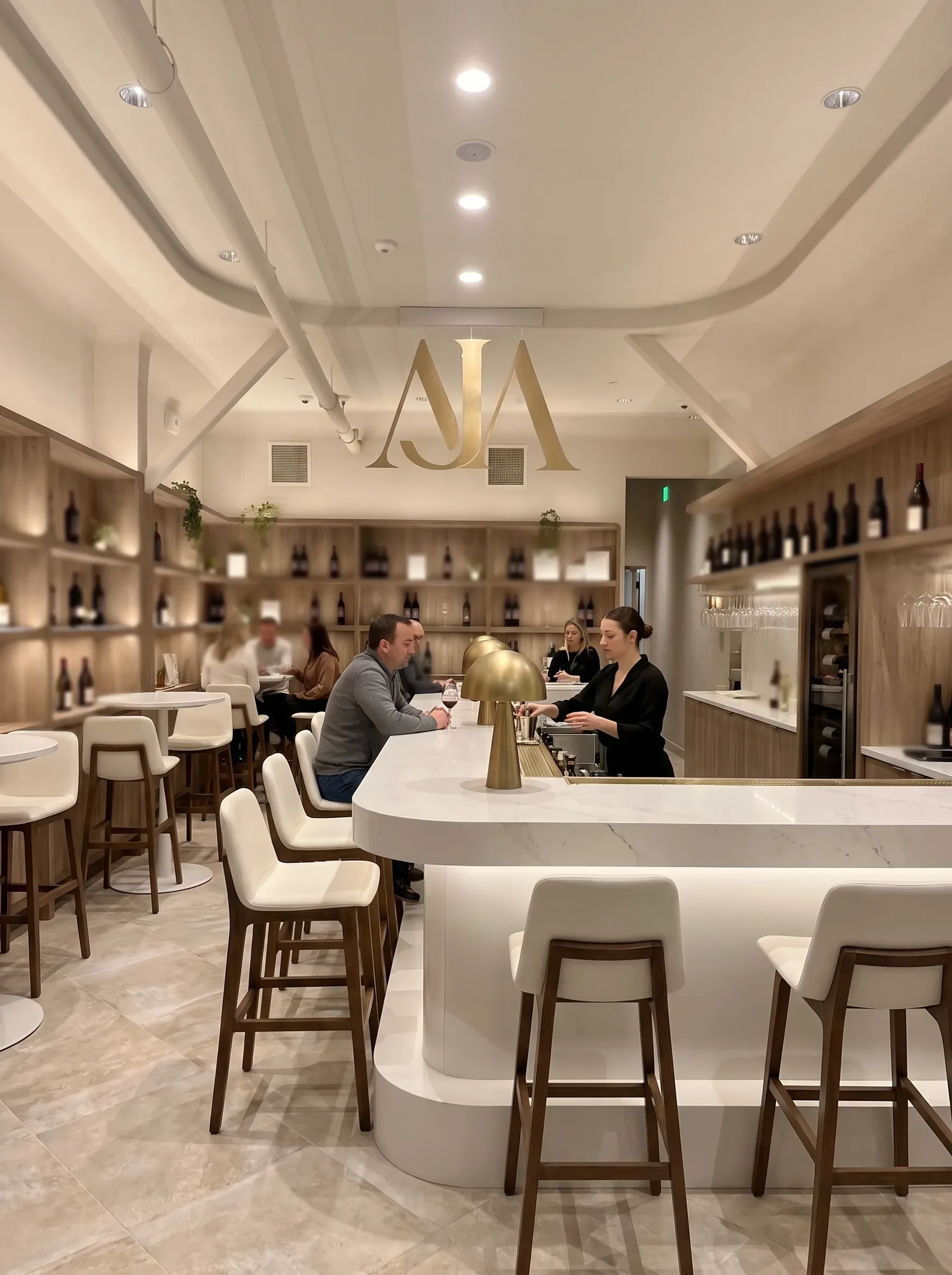 Guests enjoying wine at the AJA Santa Monica tasting room